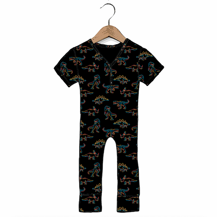 A baby short-sleeve romper in black with an all-over colorful dinosaur print, hanging on a wooden hanger against a plain white background.
