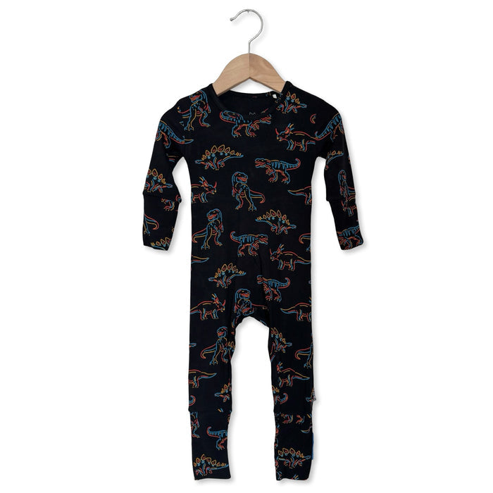 Black onesie with dinosaur pattern on a hanger against a white background
