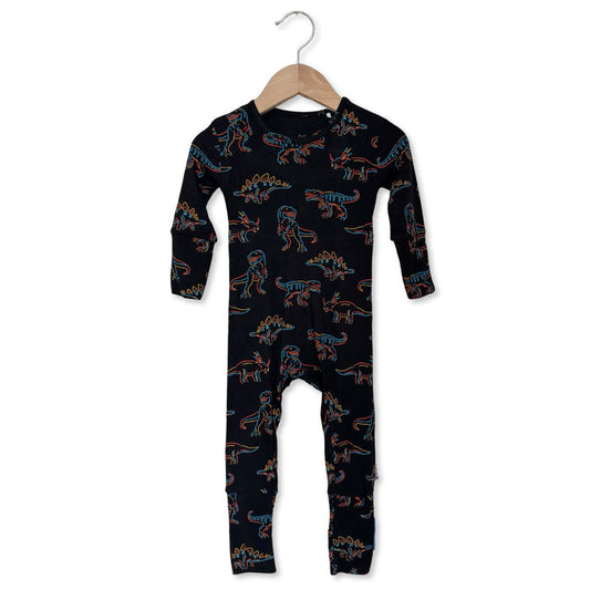 Black onesie with dinosaur pattern on a hanger against a white background