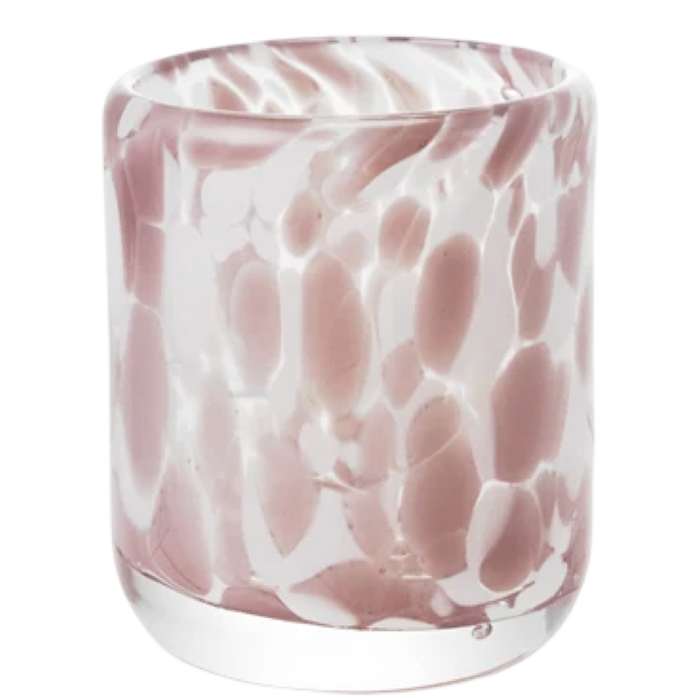 Glass tumbler with pink and white marbled pattern on a white background
