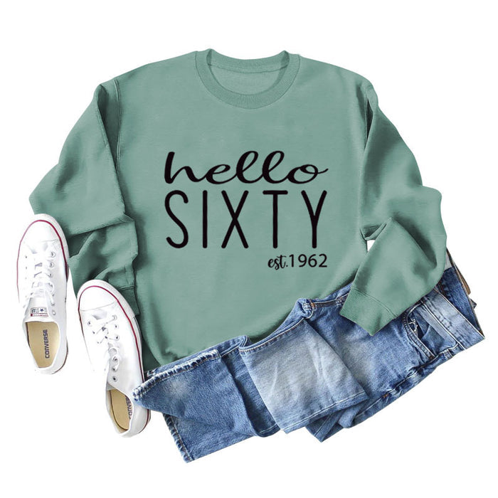Light green sweater (black font) / S