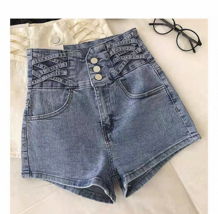 Blue denim shorts with button details on a light background