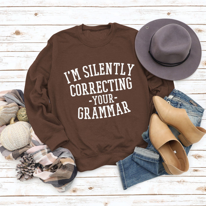 Coffee colored sweater (white font) / S