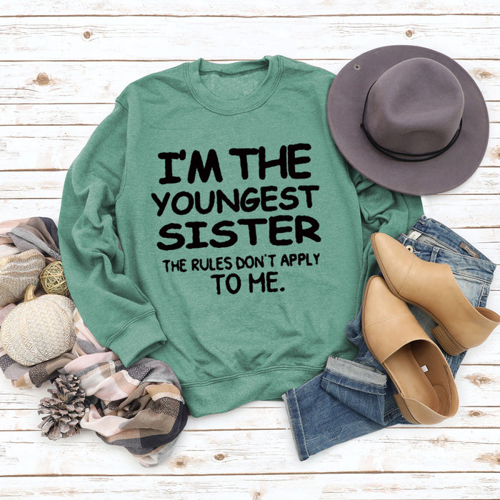 Light green sweater (black font) / S