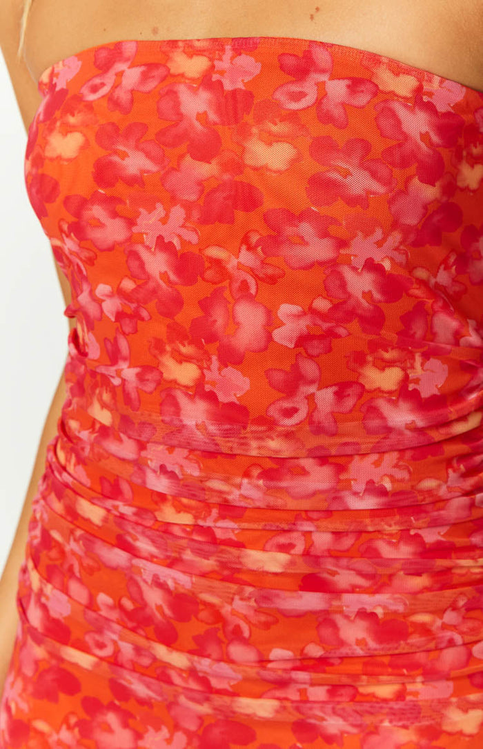 Close-up of the orange floral print mesh maxi dress showing ruched detailing on the bodice and waist