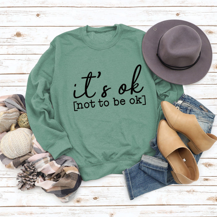 Light green sweater (black font) / S
