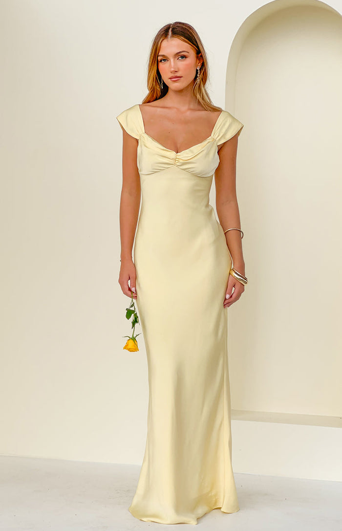 Beginning Boutique Jacky Yellow Satin Maxi Dress light yellow satin maxi dress with a sweetheart neckline, ruched bust, and short cap sleeves