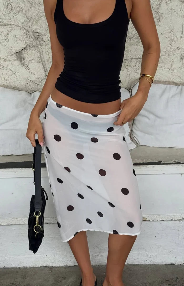 Beginning Boutique Jordan White Polka Dot Sheer Midi Skirt white sheer polka dot wrap midi skirt with an asymmetrical hem