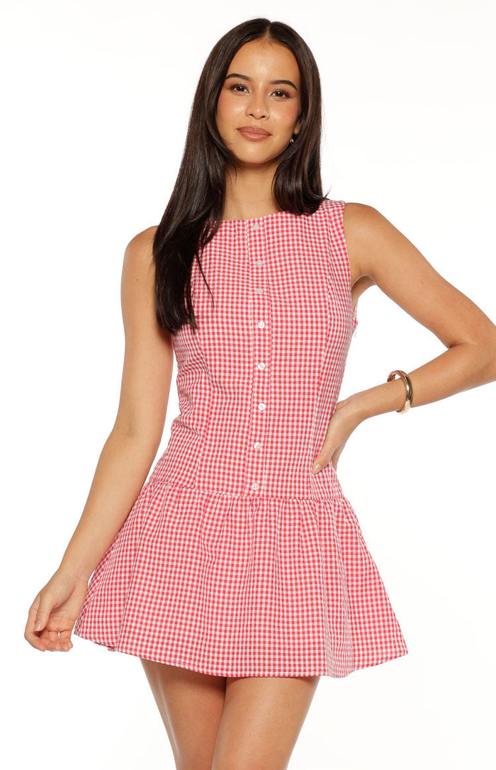 Red and white gingham mini dress with a round neckline, sleeveless design, and button-front bodice