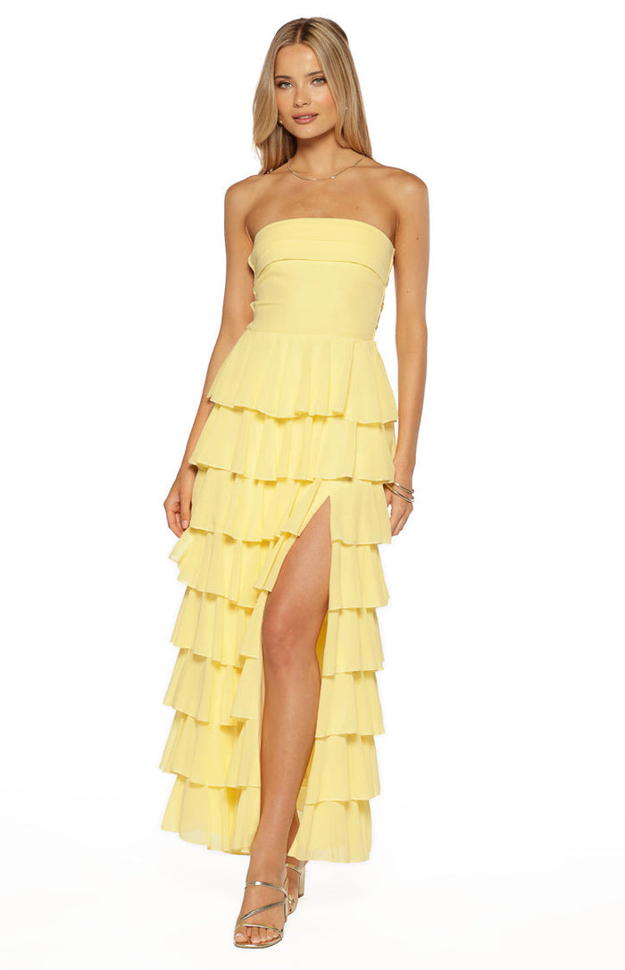 Strapless yellow maxi dress with a fitted bodice, tiered ruffle skirt, and a high leg split
