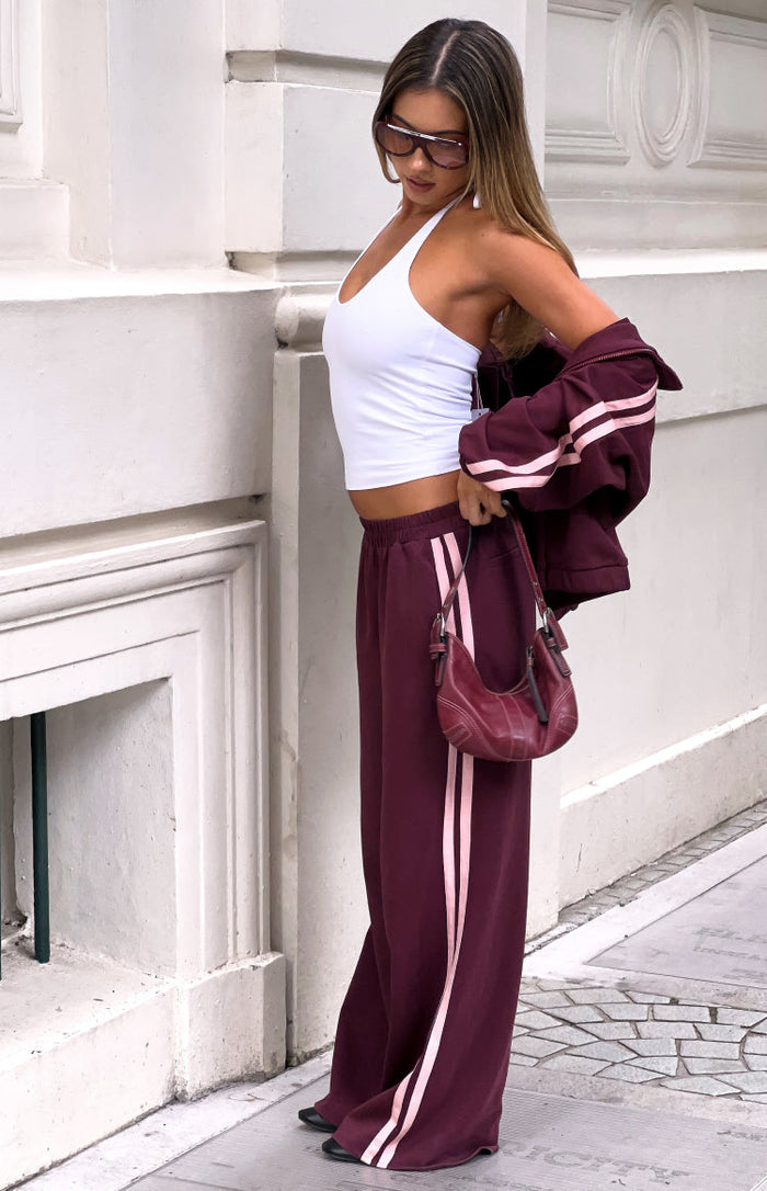 Beginning Boutique Kosie Burgundy and Pink Stripe Track Pants burgundy wide-leg track pants with double pink side stripes