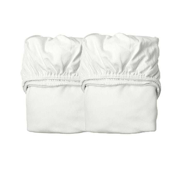 Two white Leander Organic Fitted Sheets made from soft organic cotton jersey for toshi baby