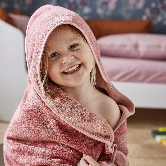Pink hooded towel from Leander Organic Hooded Towels, perfect for Toshi Baby and baby strollers