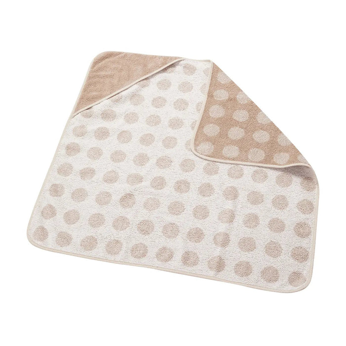 Beige and white polka dot toshi baby hooded towel from Leander Organic Hooded collection