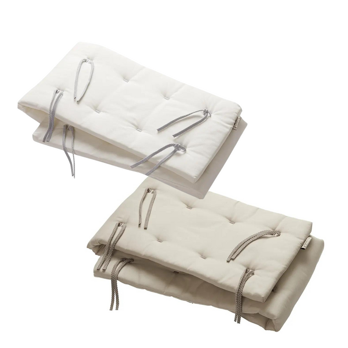 Two quilted tie-fastened cushions on Luna Cot Bumper, perfect for Toshi Baby and baby strollers