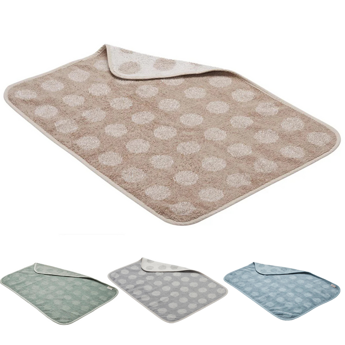 Reversible polka-dotted baby changing mat on Leander Organic Matty Topper for Toshi Baby