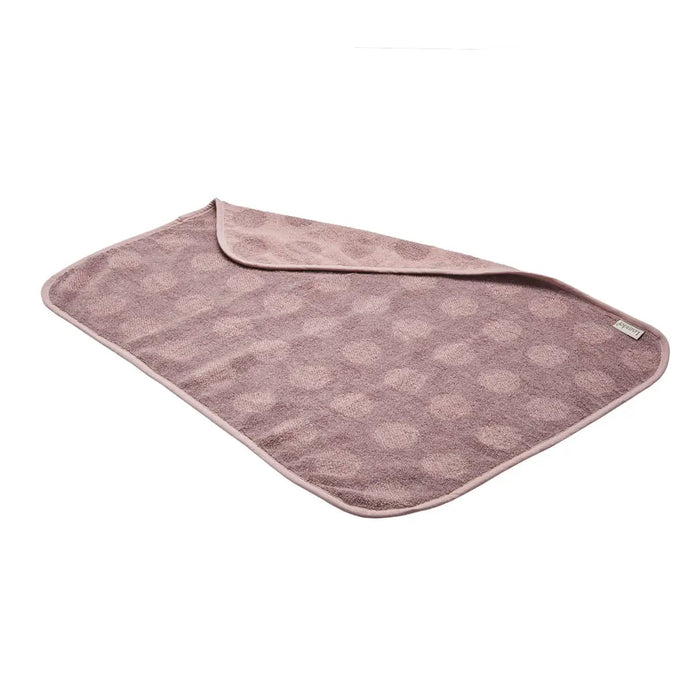 Mauve polka-dotted toshi baby changing mat made with Leander Organic Matty organic cotton terry