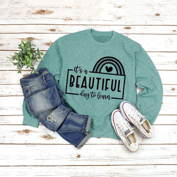 Light green sweater (black font) / S