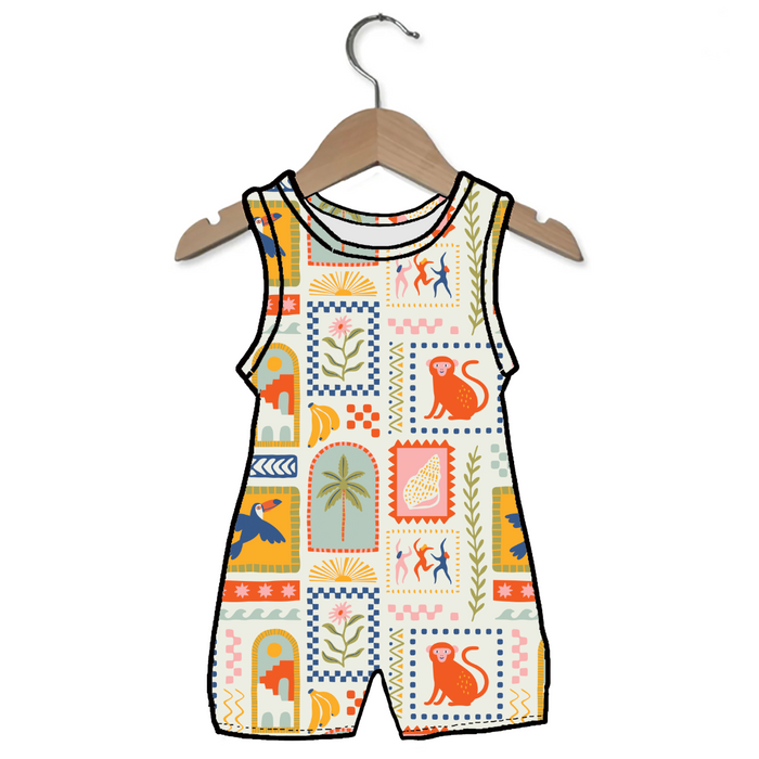 Colorful children's romper with patterns on a hanger against a white background