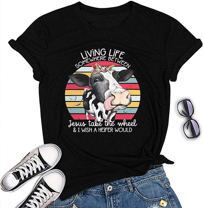 Living Life Somewhere Between Jesus Take The Wheel and Wish a Heifer Would T-Shirt Cow Shirt for Women