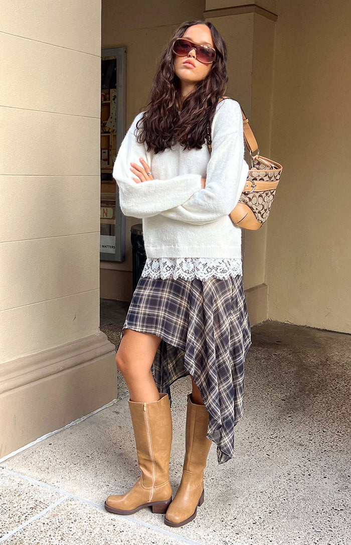Cream fuzzy knit with a relaxed fit, long sleeves, and a delicate white lace trim visible at the hem