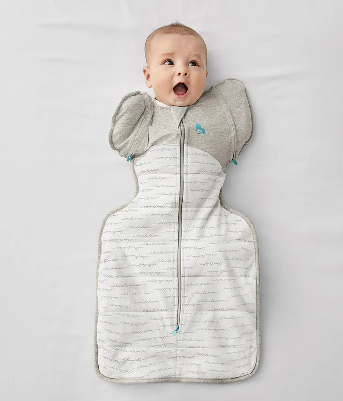 Cute baby in swaddle with arm wings from Love To Dream Swaddle Up Transition Bag 2.5 TOG