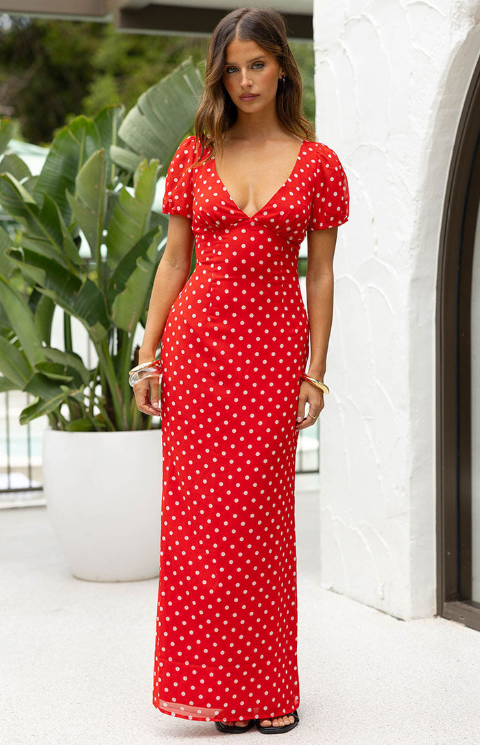 Beginning Boutique Lovella Red Polka Dot Maxi Dress red polka dot maxi dress with a deep V-neck and short puff sleeves