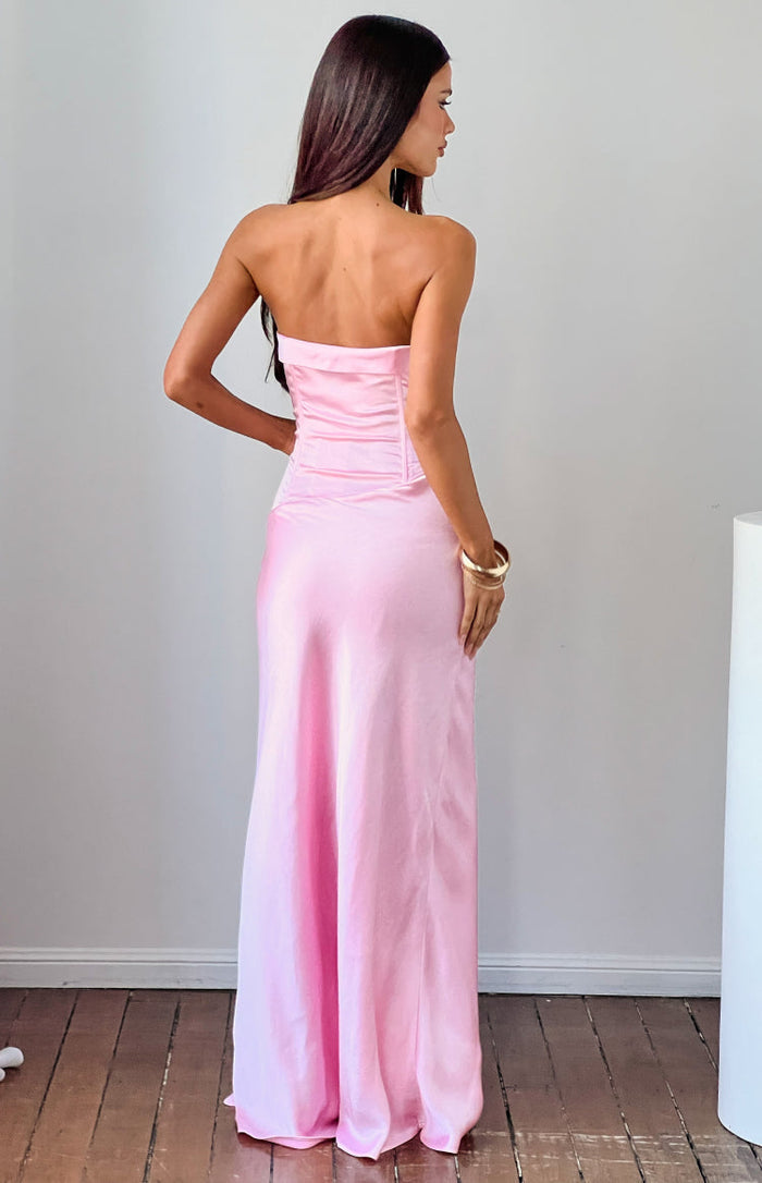 Rear view of a pink satin strapless maxi dress with a ruched corset-style bodice