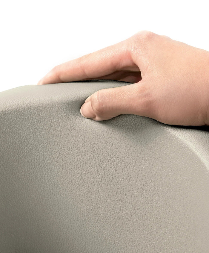Hand pressing into soft textured material of Mamas & Papas Bug 3-in-1 Floor Seat