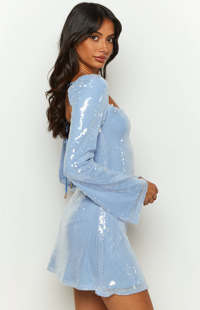 Side view of a blue sequin mini dress with long flared sleeves and a square neckline