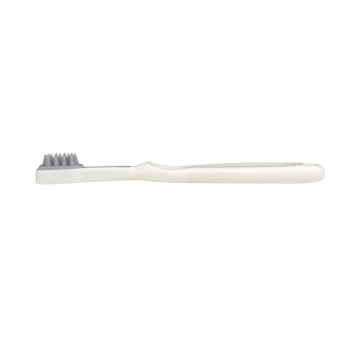 White toothbrush with gray bristles from Mininor Baby Toothbrush Set perfect for Toshi Baby Romper and baby strollers