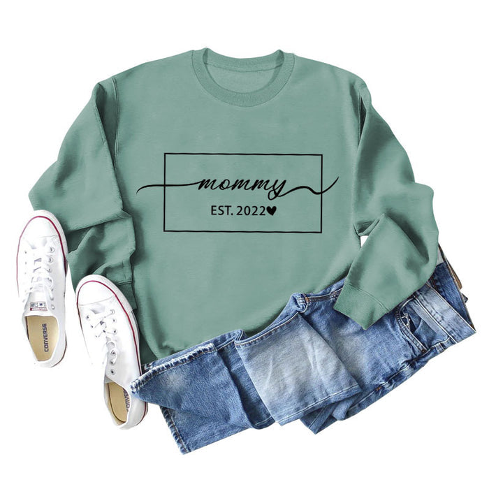 Light green sweater (black font) / S