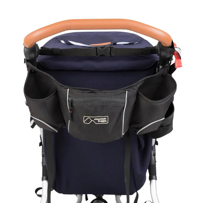 Black stroller organizer with cup holders features Mountain Buggy Pouch and reflective safety trim