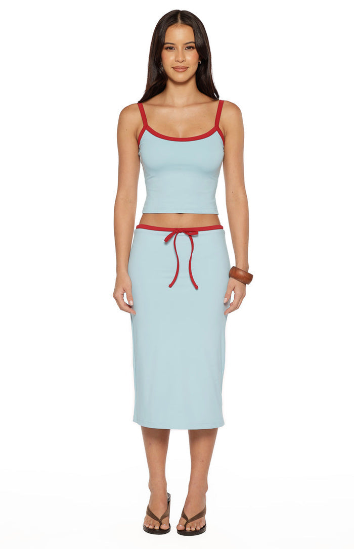 Light blue jersey midi skirt with a fitted silhouette and a red tie waist detail