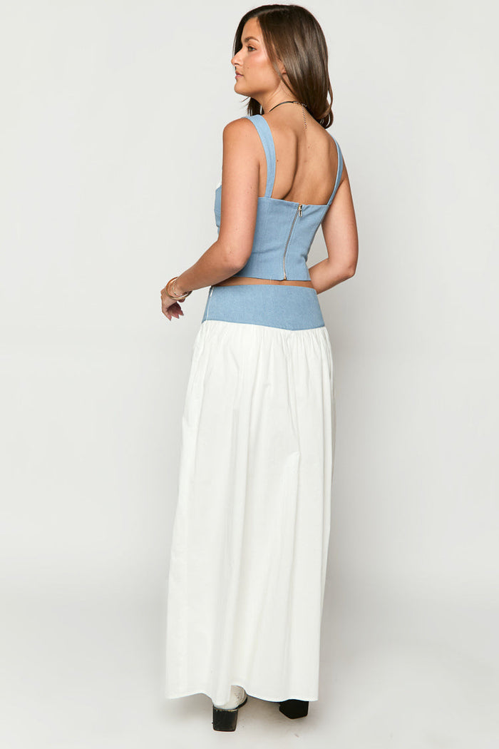 Side and rear view of a white maxi skirt with a gathered waist and full, flowing silhouette