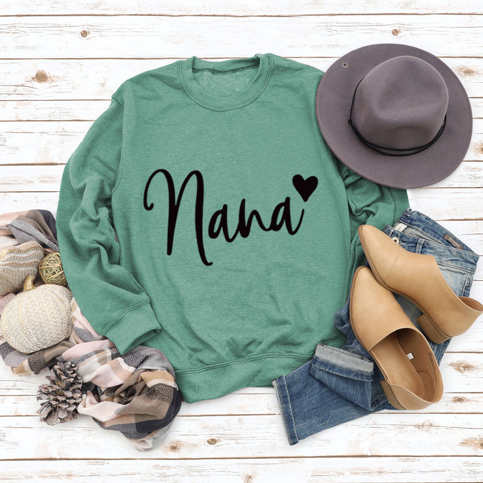 Light green sweater (black font) / S
