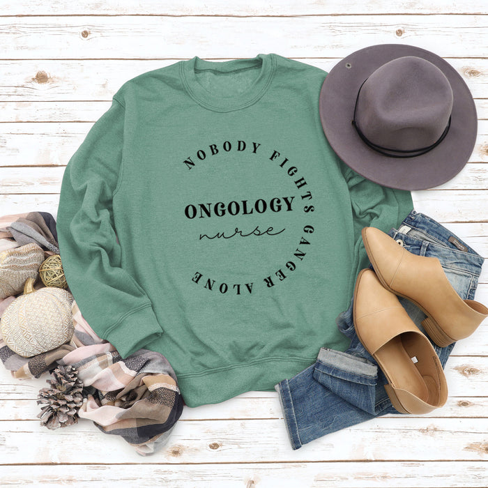 Light green sweater (black font) / S