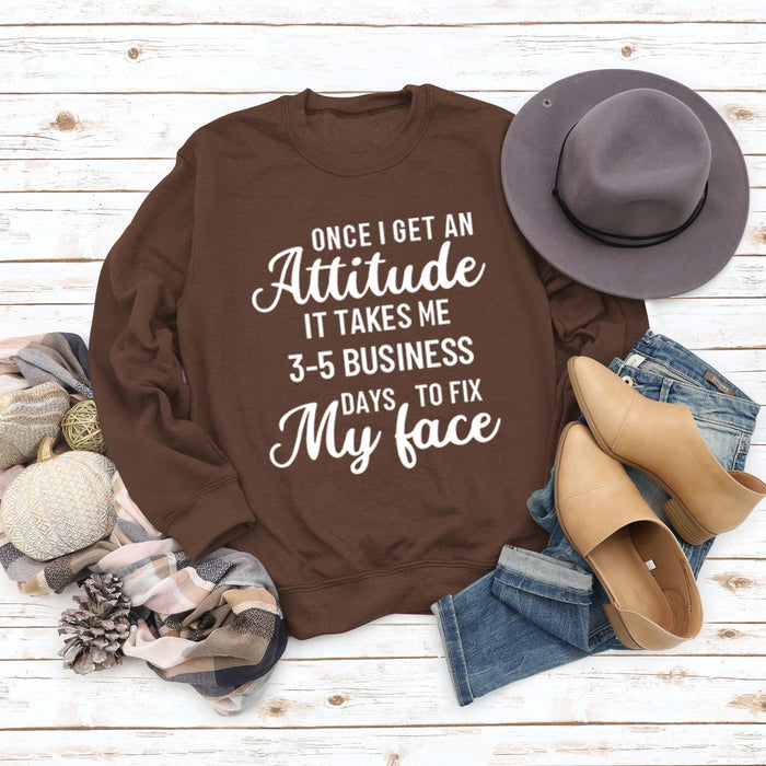 Coffee colored sweater (white font) / S