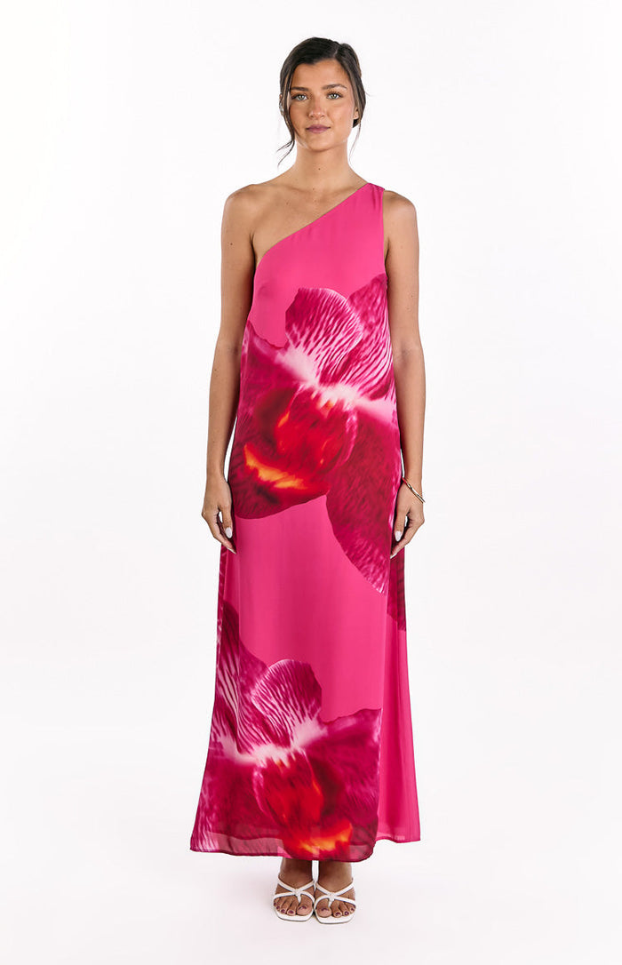 Front view of a pink one-shoulder maxi dress with a large red and pink orchid print