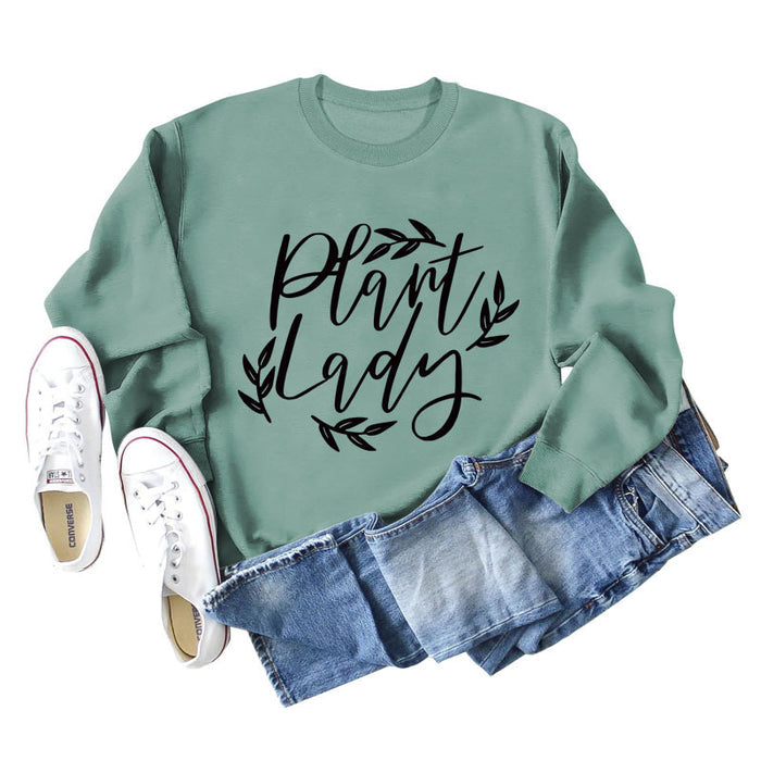 Light green sweater (black font) / S