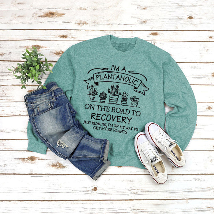 Light green sweater (black font) / S
