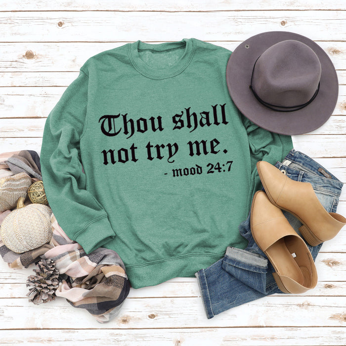 Light green sweater (black font) / S