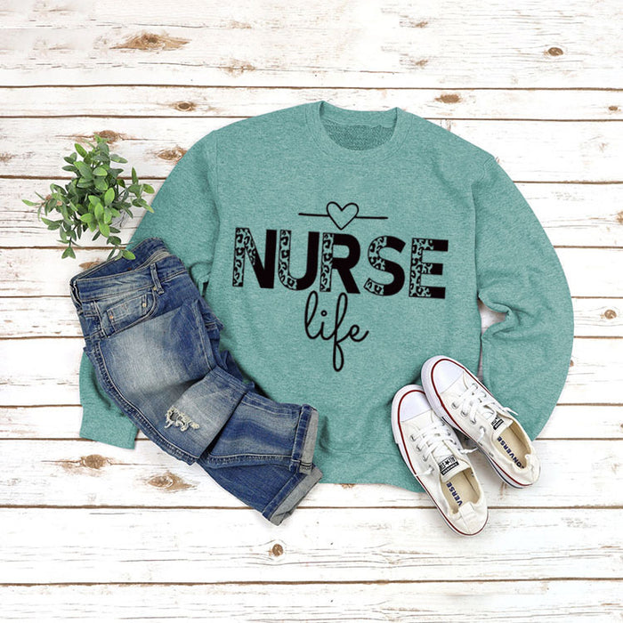 Light green sweater (black font) / S