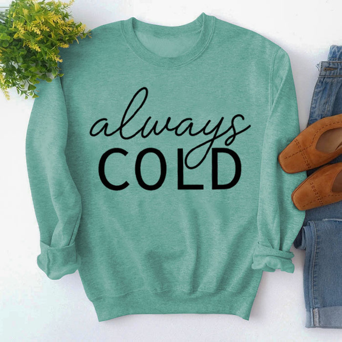 Light green sweater (black font) / S