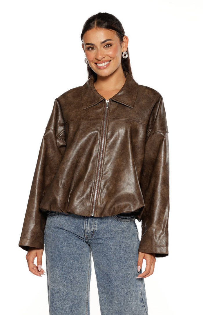 Front view of a relaxed vintage brown PU bomber jacket with a pointed collar, full zip, and bubble hem