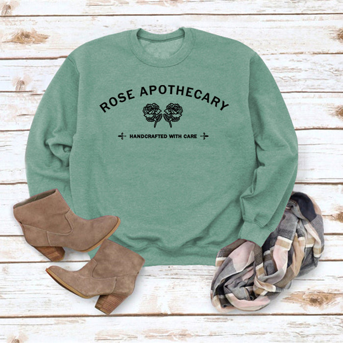 Light green sweater (black font) / S