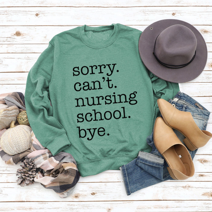 Light green sweater (black font) / S