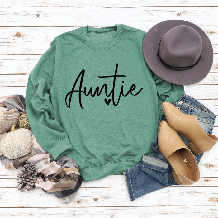 Light green sweater (black font) / S