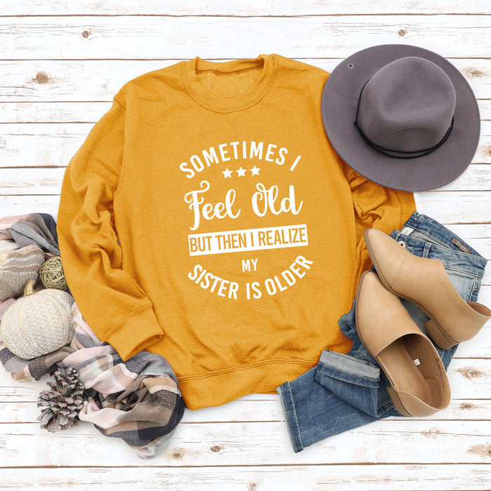 Yellow sweater (white font) / S