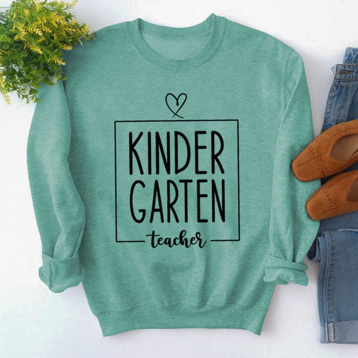 Light green sweater (black font) / S
